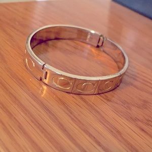 Coach signature gold colored bangle bracelet